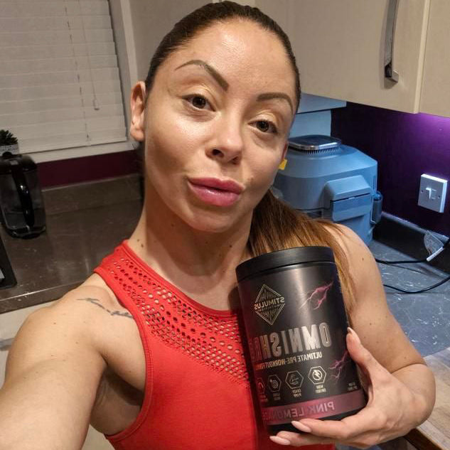 Customer in a red workout top holding the OMNISHRED tub